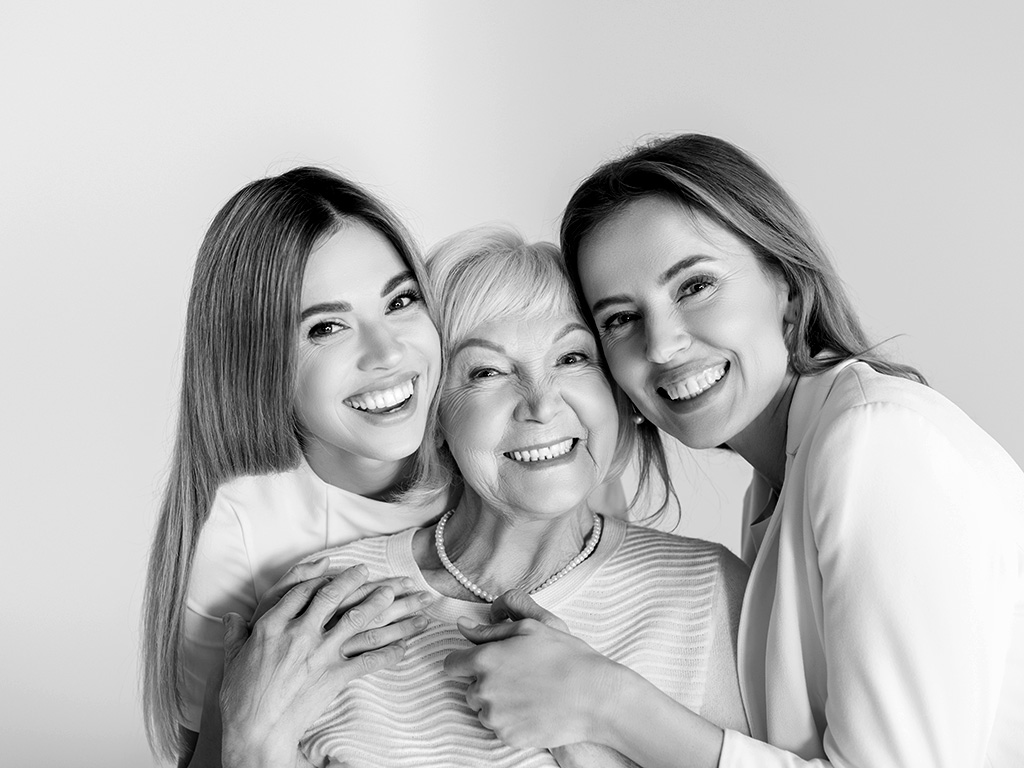 three generations of smiling happy women